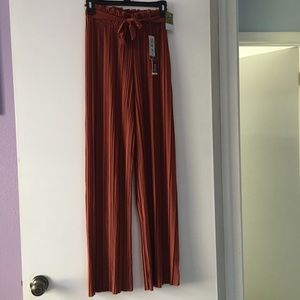 High waisted burnt orange pleated pants